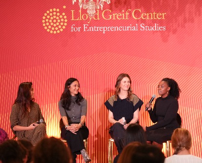 Four female panelists on stage