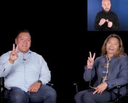 David Flores and Mike Paranal give the Fight On sign.