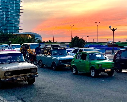 Cars in Cuba at sunset