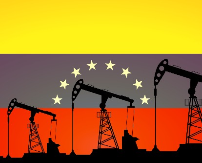 oil derricks in front of the venezuela flag