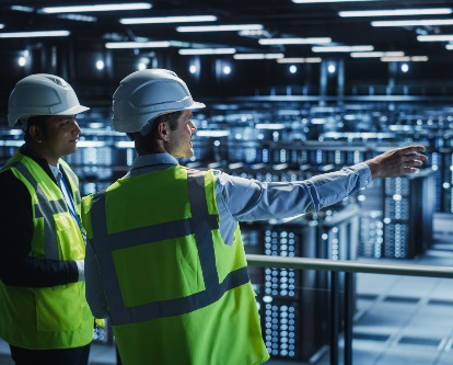 two workers in a data center