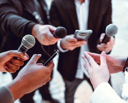 decorative image of microphones conducting interview