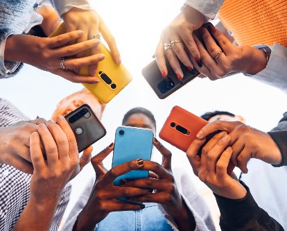 Students using phones in a circle