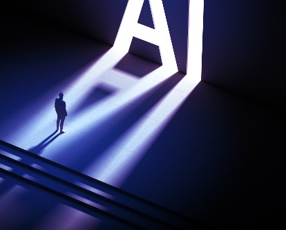 decorative image of man standing in front of huge AI sign