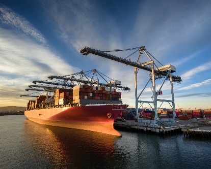 decorative image of a cargo ship at a port