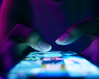 fingers typing on phone