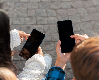 teenagers using their phones