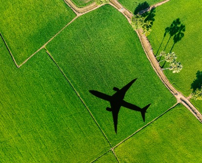 jet silhouette flying over field