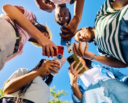 teens on their phone in a circle