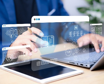 hands typing on a computer with digital screens in front