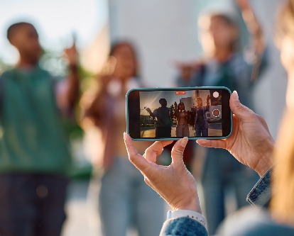 someone taking a photo with an iphone