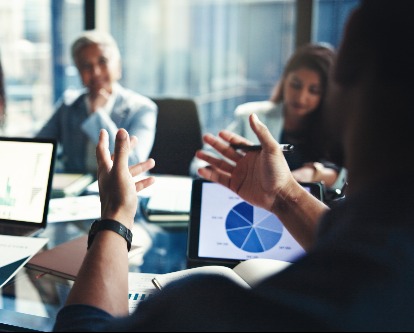 image of person gesturing at meeting