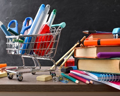 school supplies in a small shopping cart