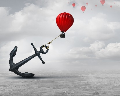 Held back metaphor as a large anchor holding or oppressing an air balloon and restricting movement as a suppression business metaphor from aspiring to succeed with 3D illustration elements.