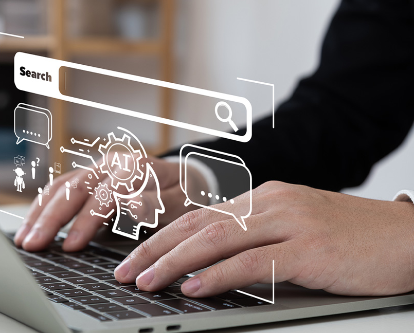 Two hands type on a laptop keyboard underneath a graphic contain multiple generic computer symbols.