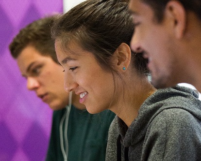 Three students at USC in a classroom.