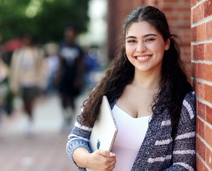 A female-presenting student on the campus of USC.