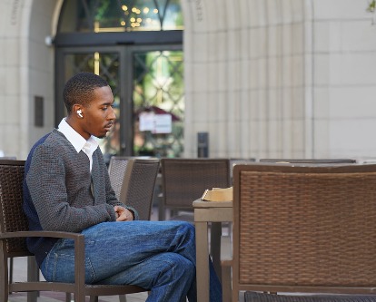 A male-presenting student on the campus of USC.
