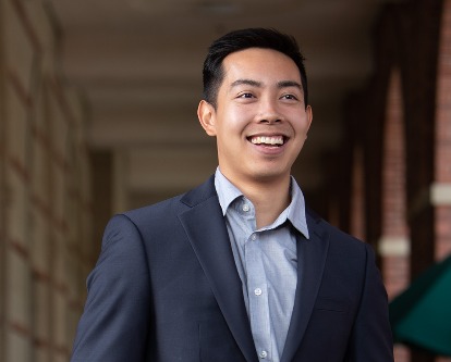 USC Marshall graduate student smiling on campus.