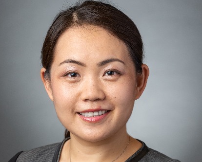 Professor Nan Jia, a female wearing dark grey shirt with a ponytail.