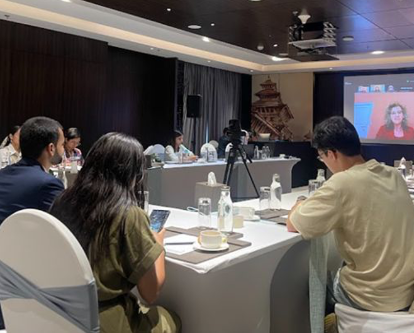 People with their backs to the camera at a conference