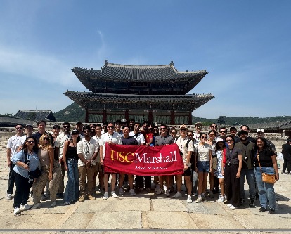 students standing in front of a Gyeongbok Palace