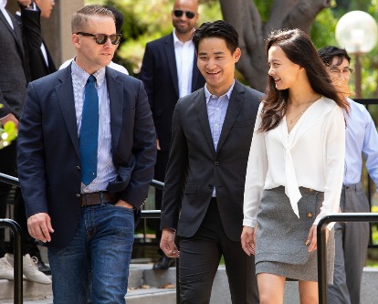 Color photograph of students from the MS Finance program walking on the USC campus.
