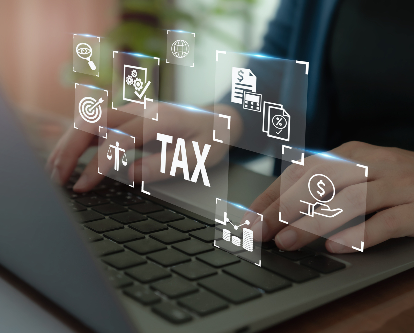 decorative image of taxes being done on computer