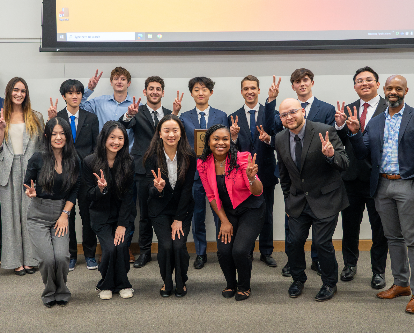 Business Stats Competition contestants doing Fight On