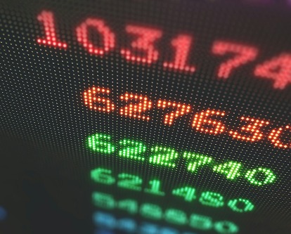 Stock prices on a black screen.