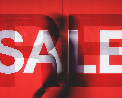 Red story window with "Resale" sign.