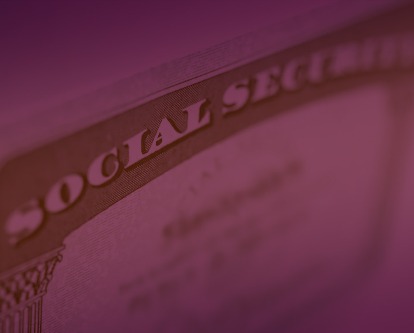 A blurred image of a Social Security card.