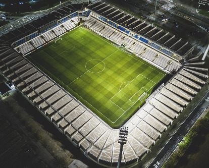 Overhead a soccer stadium at night.