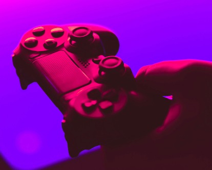 Video game controller in a hand.