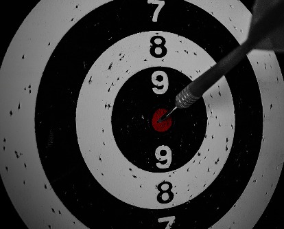A dart hitting on bullseye.