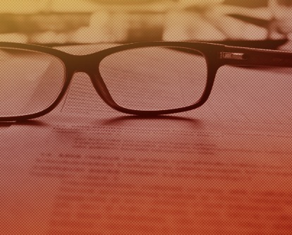 Reading glasses on a contract.