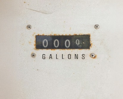 A vintage gas pump showing zeros.