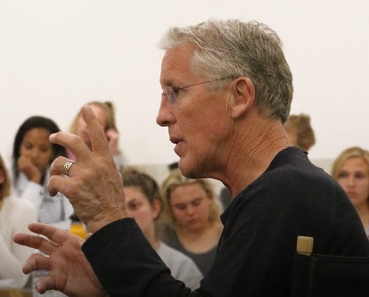 Pete Carroll speaking to a class.