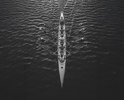A four-person crew team in the water.