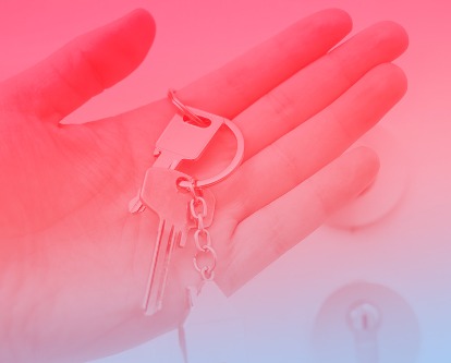 A hand holding keys.
