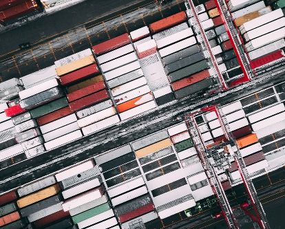 Overhead color photograph of a yard filled with shipping containers.