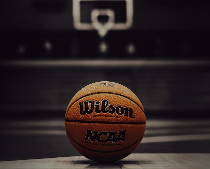 NCAA basketball on a court.