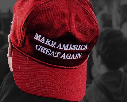 Color image of person wearing a "Make America Great Again" hat backwards.