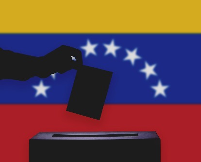 Casting a ballot with Venezuelan flag in the background.