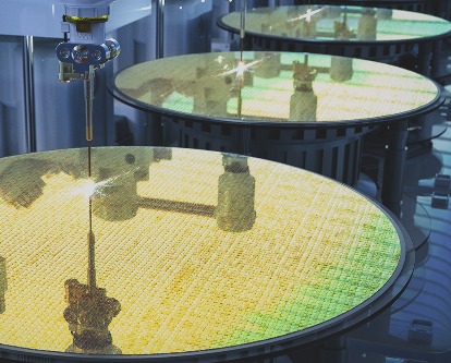 Semiconductor manufacturing with robotic arms.