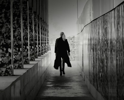 Woman walking away from camera.