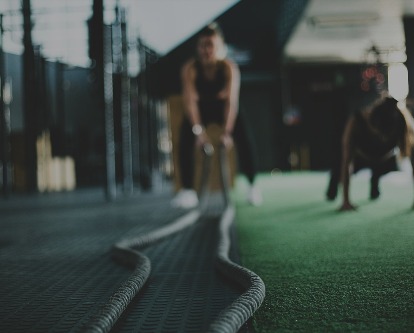 Two athletes in an indoor training facility.