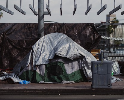 Color photograph of a tent on an urban street.