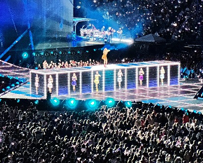 Color photograph of a stadium concert.