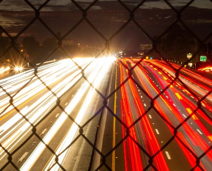 Slow shutter speed photo of traffic at night on a Los Angeles freeway.